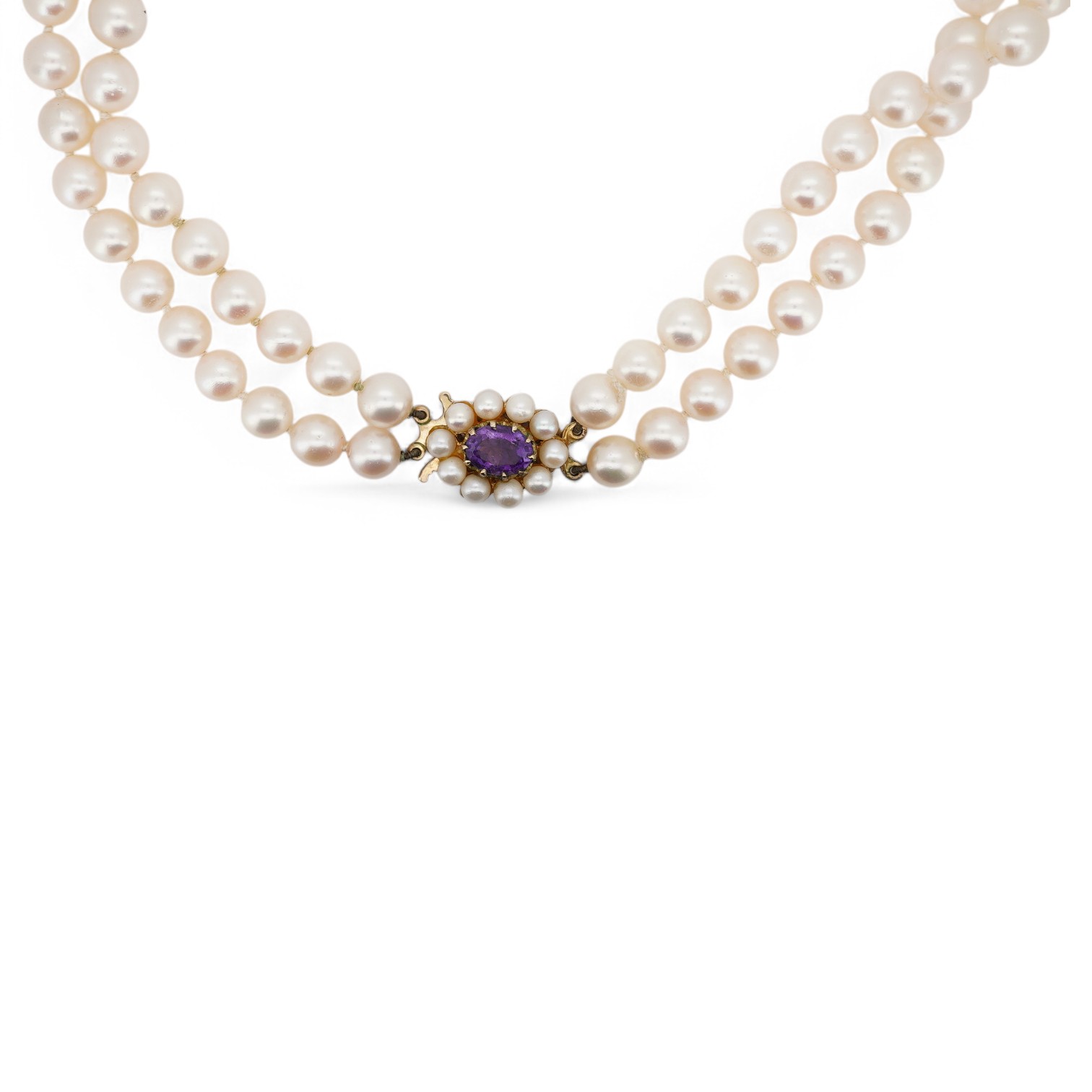 A modern twin strand cultured pearl necklace, with amethyst and cultured pearl cluster set 9ct gold clasp, 44cm. Condition - fair to good